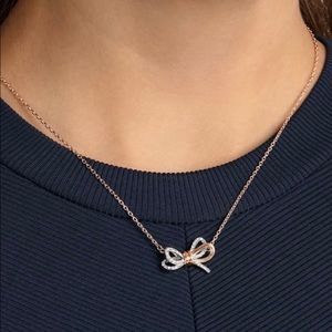 Brand New. Swarovski 
Lifelong Bow pendant
Bow, White, Mixed metal finish